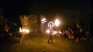 Penelope spinning fire during a performance in Peace Park.