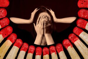 A exhausted professional experiencing burnout after losing resilience in the workplace.