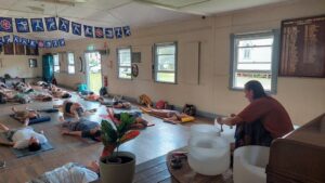 Trevor leading a sound healing class at Starlight 2025.